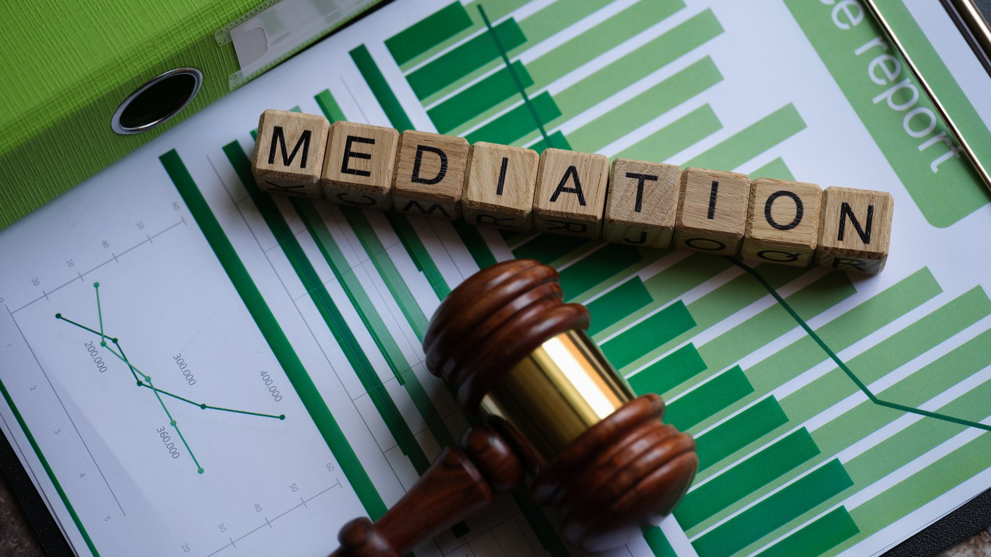 Wooden Cubes with Word Mediation and Judge Gavel on Documents